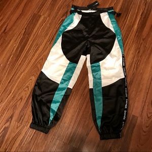 FashionNova satin-like jogger pants.